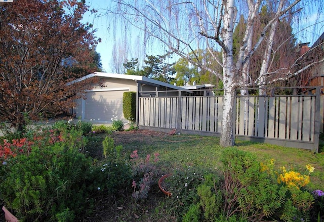 view of yard featuring a garage