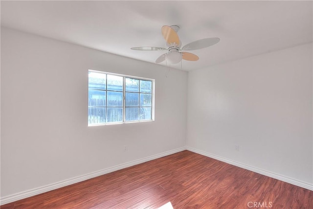 unfurnished room with wood-type flooring and ceiling fan