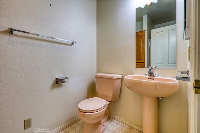 bathroom featuring toilet