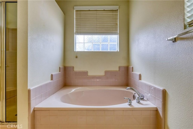 bathroom with shower with separate bathtub