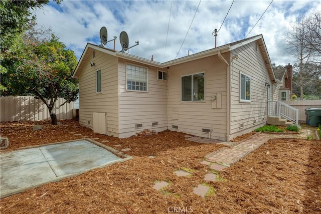 rear view of property featuring a patio area