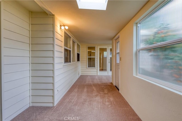 hall featuring a skylight