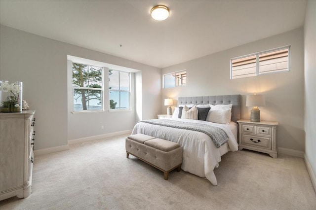 bedroom featuring light colored carpet