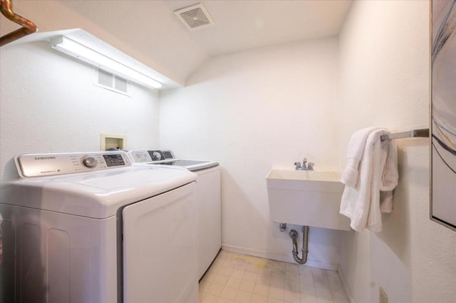 laundry room featuring separate washer and dryer and sink