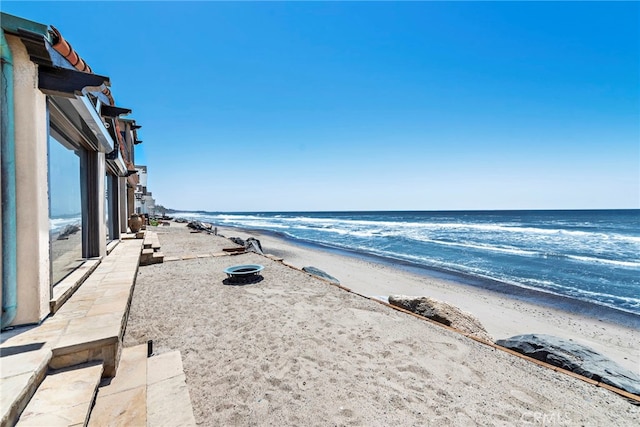 view of water feature with a beach view