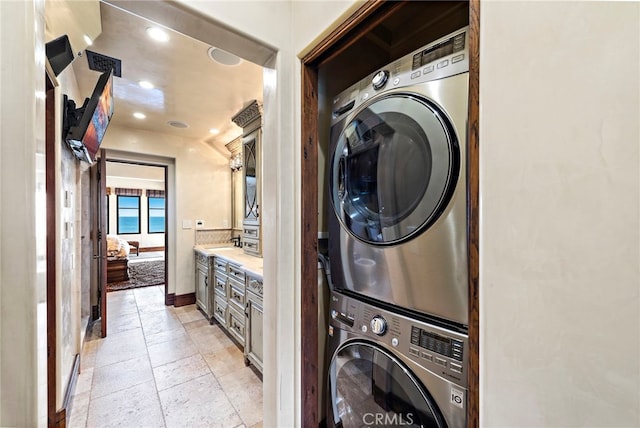 washroom with stacked washer / dryer