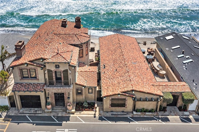 bird's eye view featuring a view of the beach and a water view