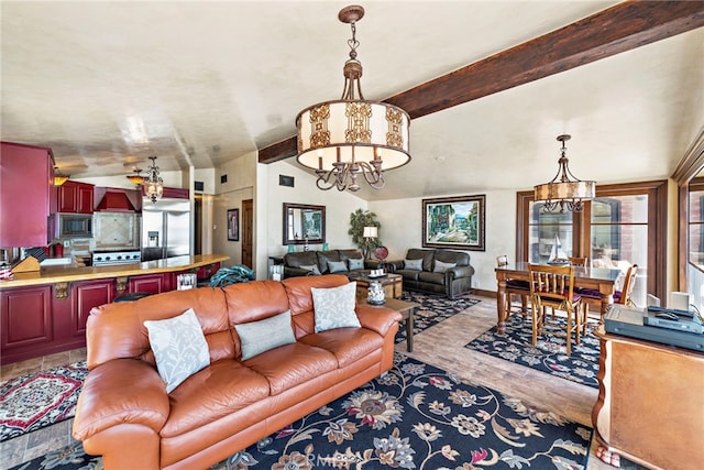 living room with a chandelier, light hardwood / wood-style flooring, and vaulted ceiling with beams