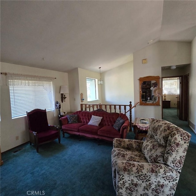 carpeted living room with lofted ceiling