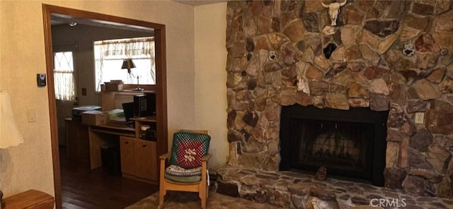 living area featuring a fireplace