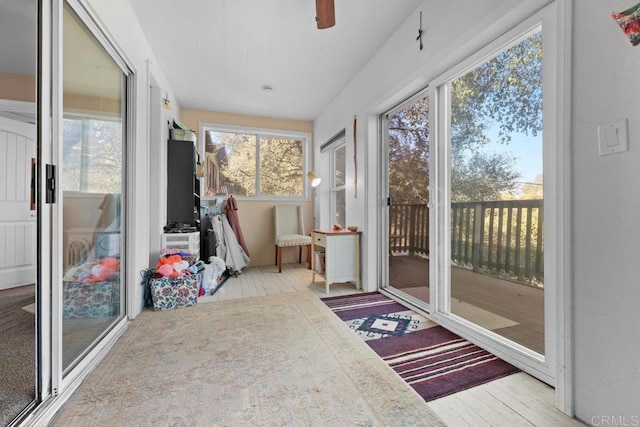 sunroom featuring ceiling fan