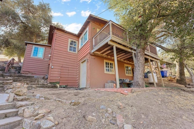 rear view of property with a deck