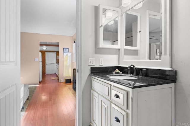 bathroom with vanity and wood-type flooring