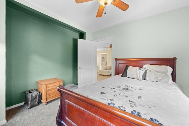 bedroom featuring light carpet and ceiling fan