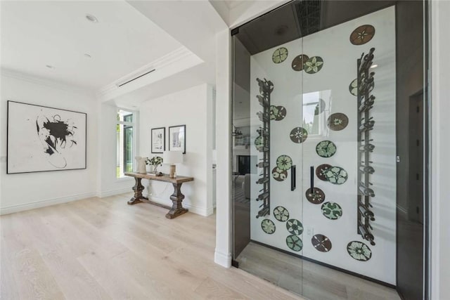 interior space featuring crown molding and wood-type flooring