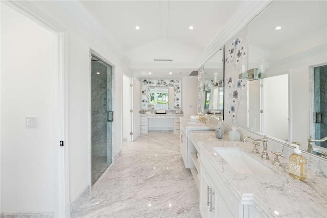 bathroom featuring vanity, crown molding, vaulted ceiling, and a shower with shower door