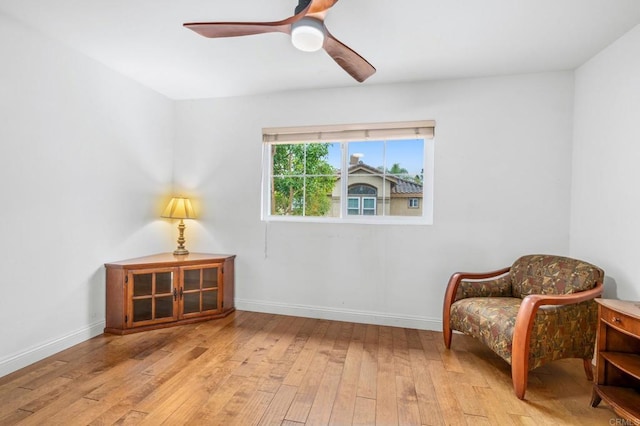 living area featuring ceiling fan and light wood-type flooring