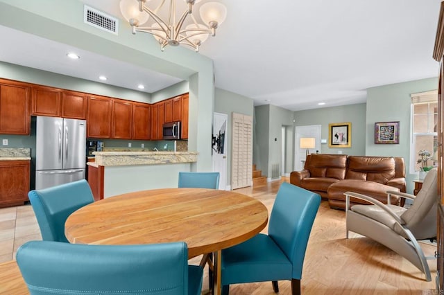 dining room with a notable chandelier