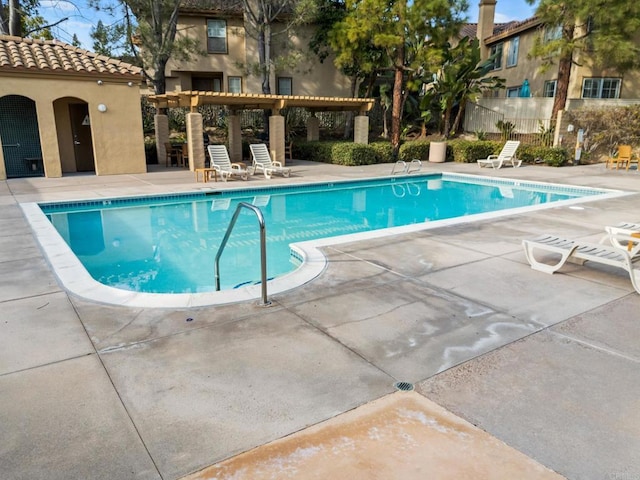 view of swimming pool with a pergola and a patio area