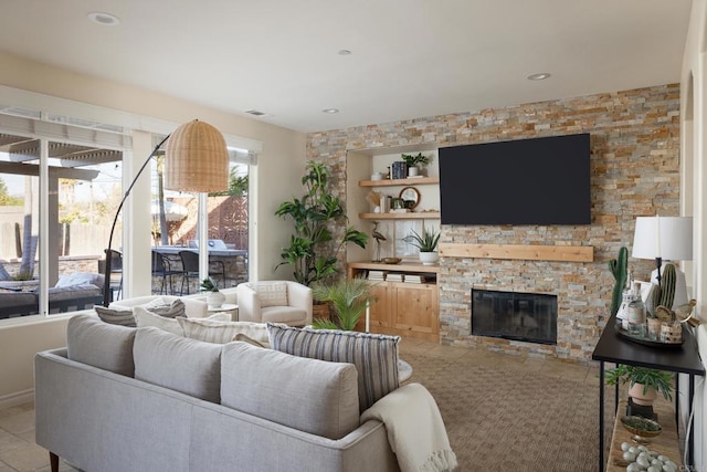 living room featuring light tile patterned flooring and a fireplace