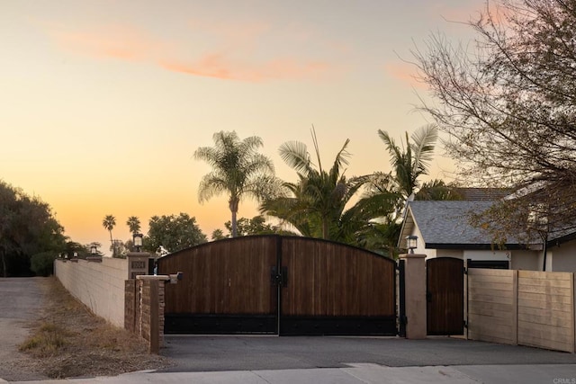 view of gate at dusk