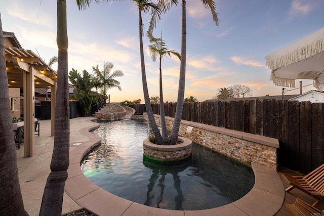 view of pool at dusk