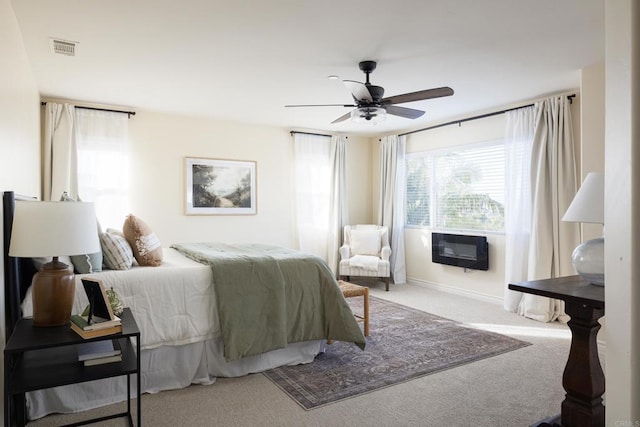 bedroom featuring ceiling fan and carpet floors