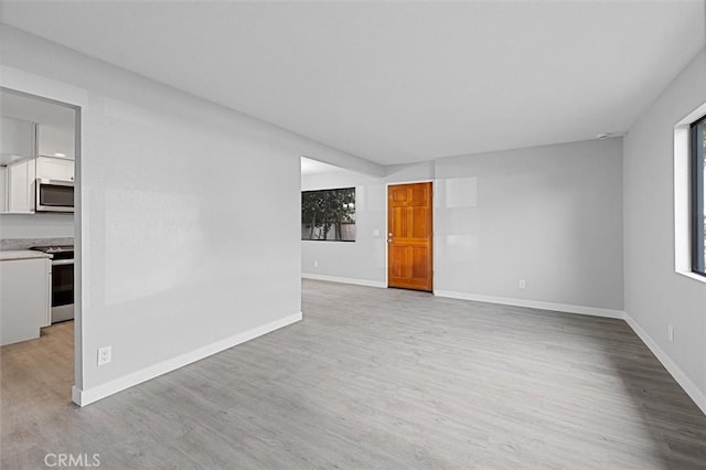 unfurnished room featuring light wood-type flooring