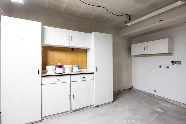 kitchen featuring white cabinets