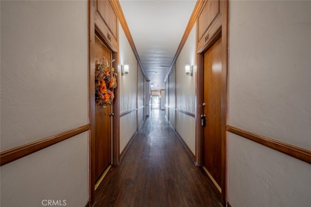 hall featuring crown molding and dark wood-type flooring