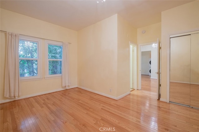 spare room with light wood-type flooring