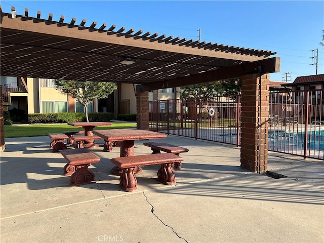 view of home's community with a pool and a pergola