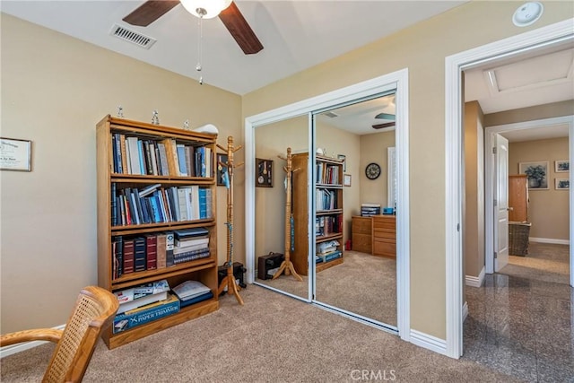 living area featuring ceiling fan