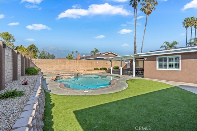 view of pool featuring a mountain view, a yard, and a patio area