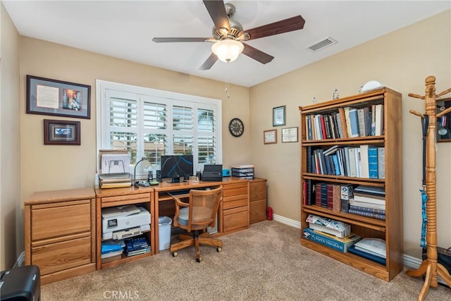 home office with light colored carpet and ceiling fan