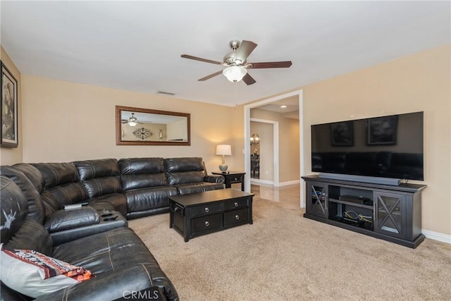 carpeted living room featuring ceiling fan