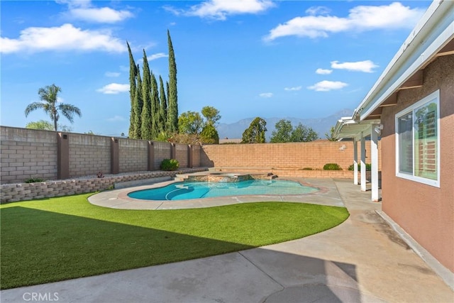 view of swimming pool featuring a yard, a mountain view, and a patio