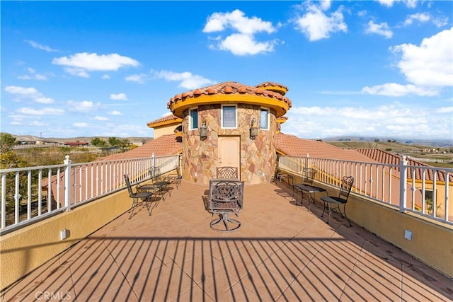 wooden terrace with a patio