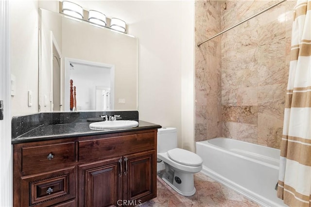 full bathroom featuring vanity, shower / tub combo, and toilet