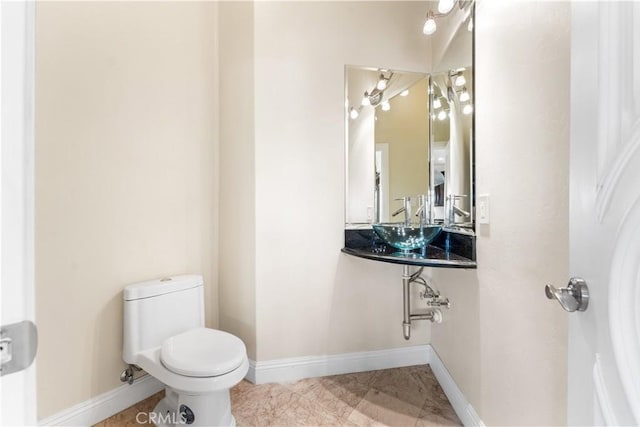 bathroom with sink and toilet