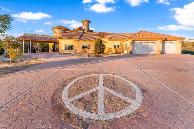 mediterranean / spanish-style house featuring a garage