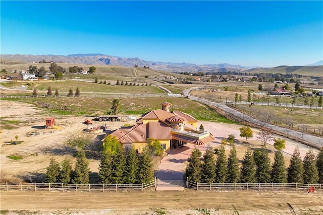 birds eye view of property with a rural view and a mountain view