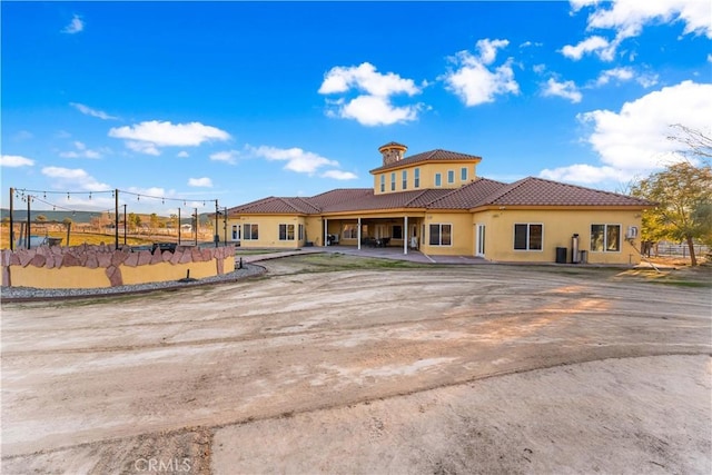 rear view of house featuring a patio area