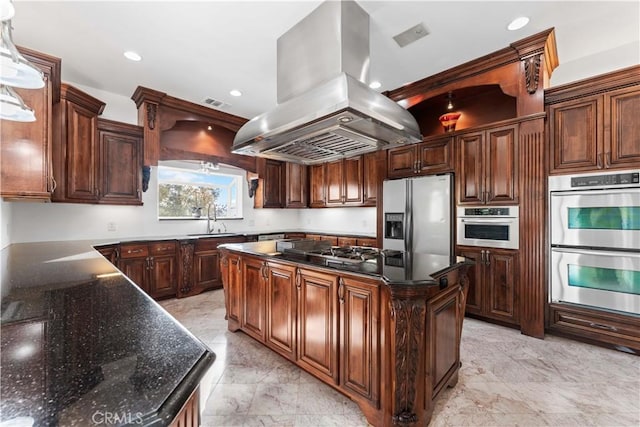 kitchen featuring sink, a center island, appliances with stainless steel finishes, pendant lighting, and island exhaust hood