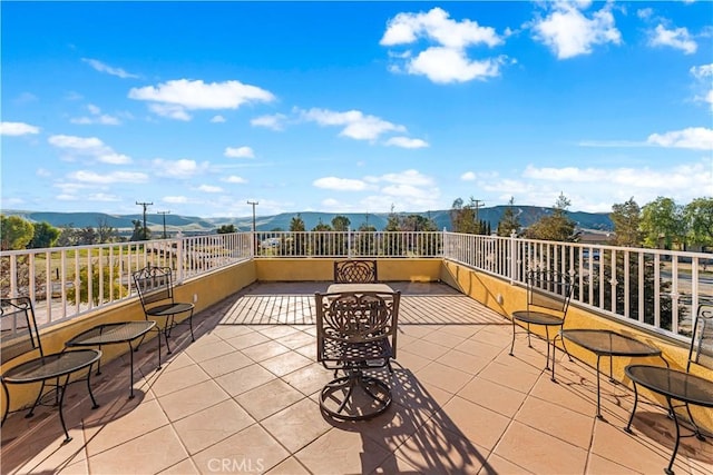 view of patio / terrace with a mountain view