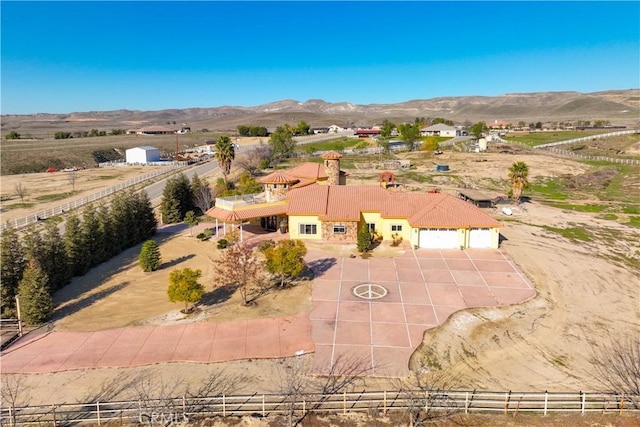 birds eye view of property featuring a mountain view