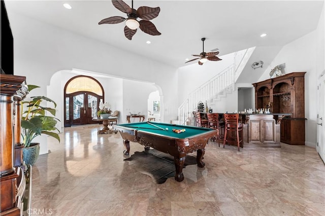 game room with ceiling fan, bar area, and pool table