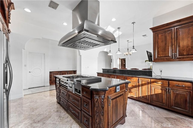 kitchen featuring appliances with stainless steel finishes, a kitchen island, hanging light fixtures, island exhaust hood, and dark brown cabinetry