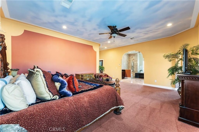 carpeted bedroom featuring connected bathroom and ceiling fan