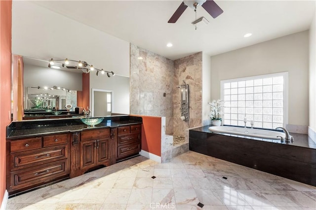 bathroom featuring vanity, shower with separate bathtub, and ceiling fan